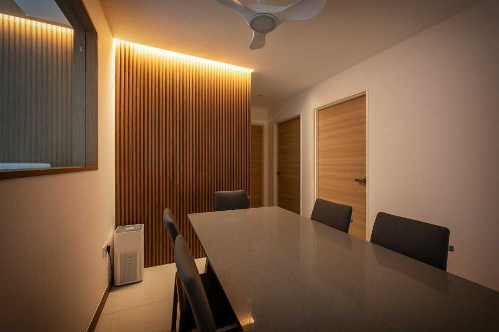 Contemporary Dining Room with Feature Wall and Drop Light
