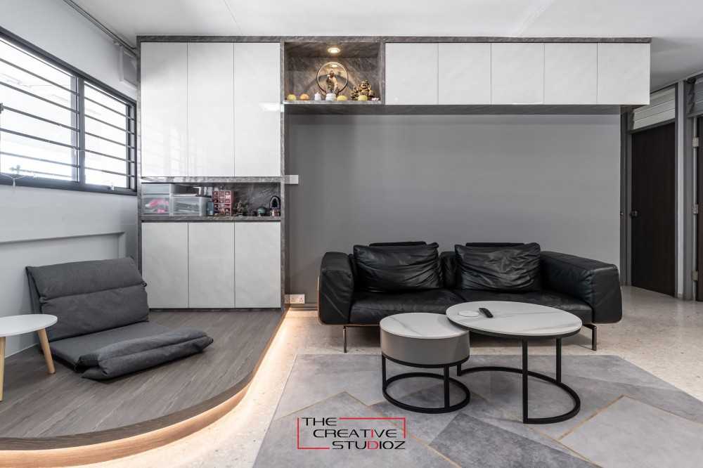 Modern Living Room with Bookshelf and Homogeneous Tiles