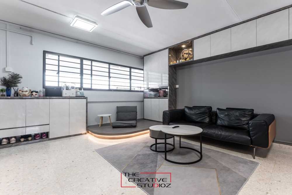 Modern Living Room with Bookshelf and Homogeneous Tiles