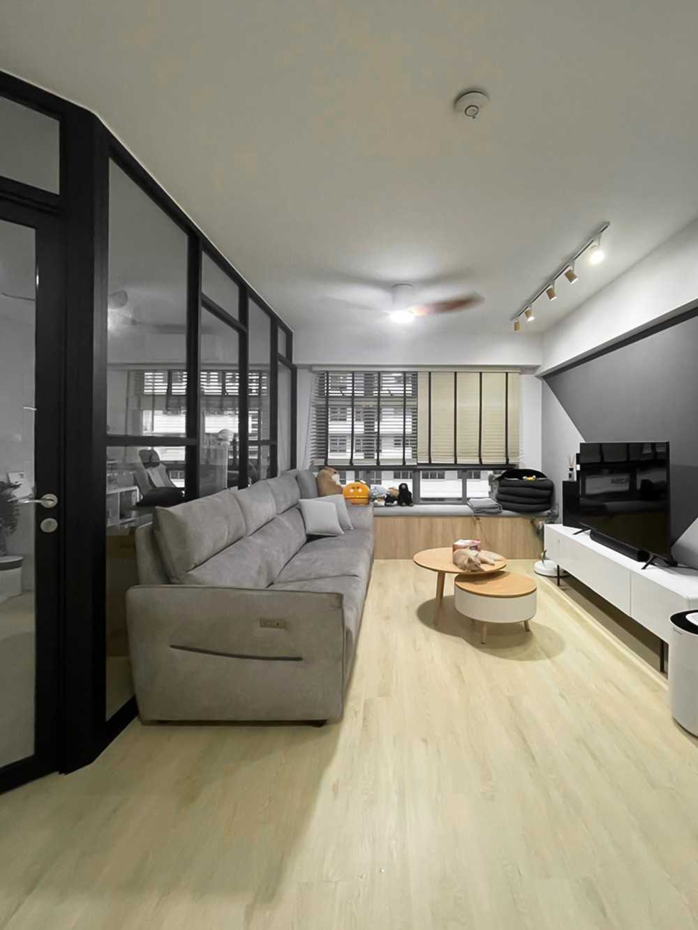 Scandinavian Living Room with TV Console and Window Seat