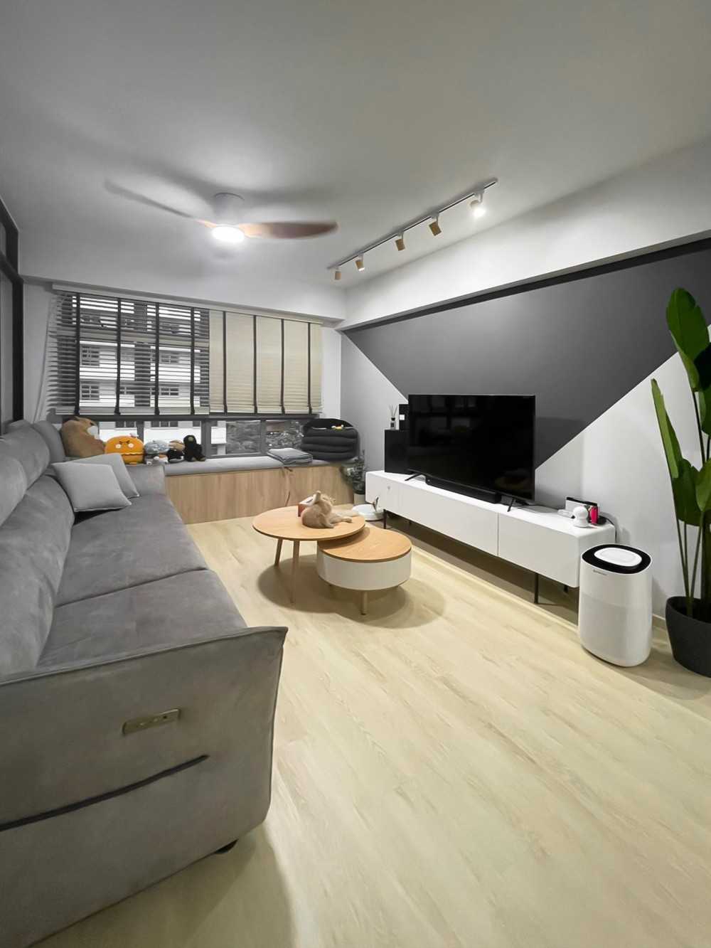 Scandinavian Living Room with TV Console and Window Seat