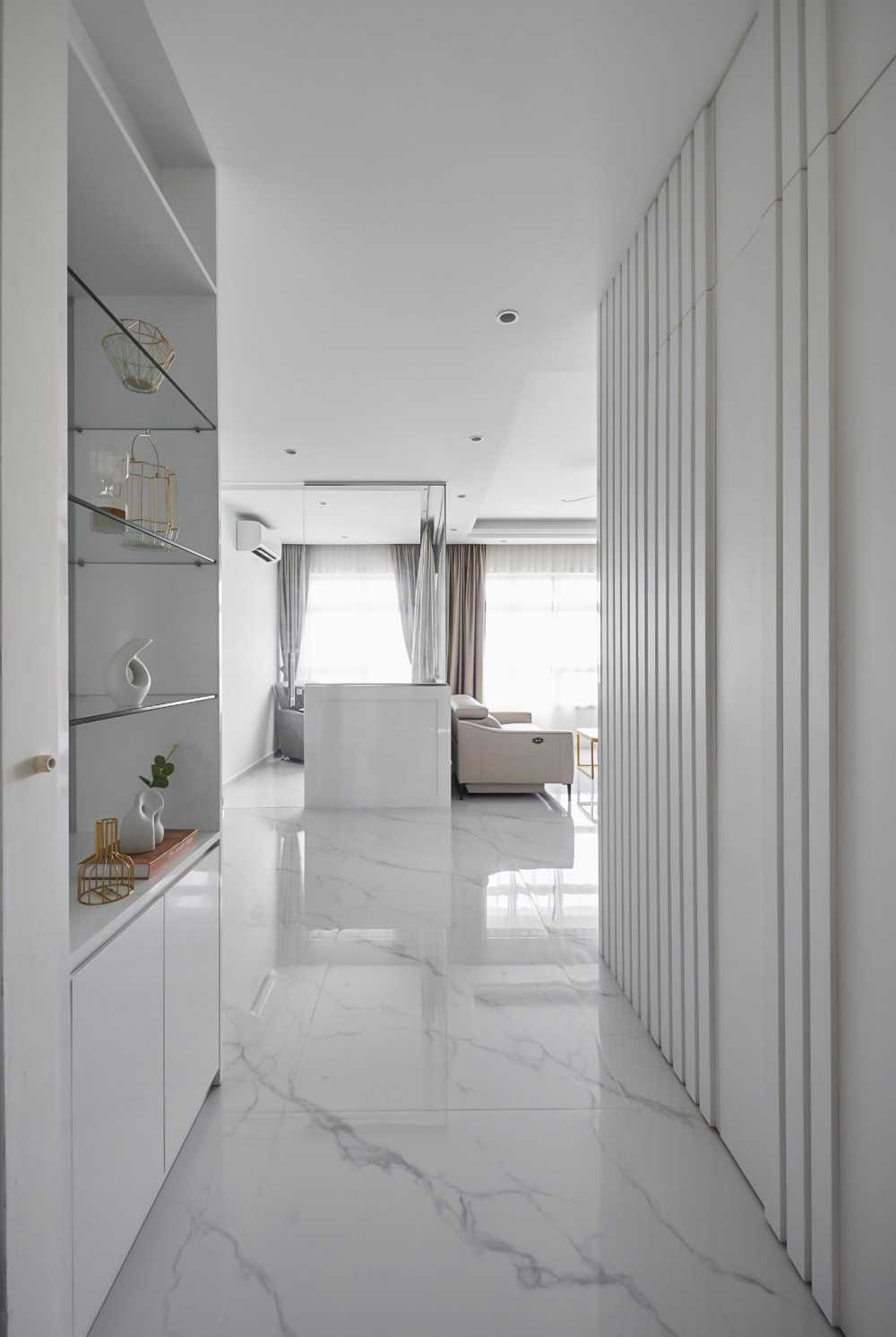 Modern Entryway with Paintings and Storage Cabinets