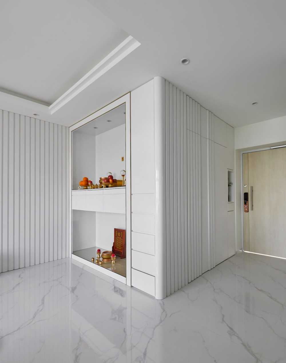 Modern Foyer with Paintings and Storage Cabinets