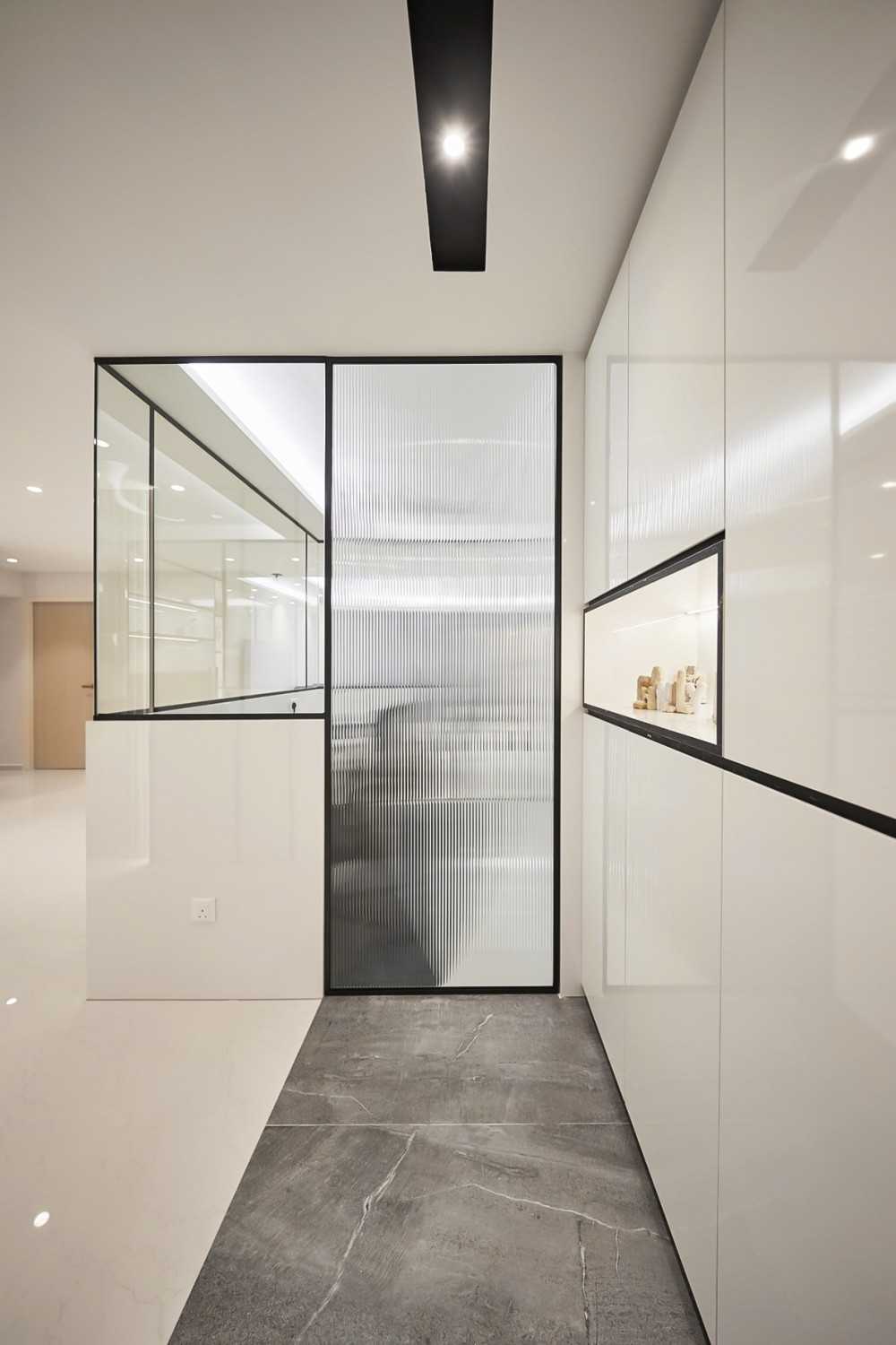 Modern Foyer with Paintings and Storage Cabinets