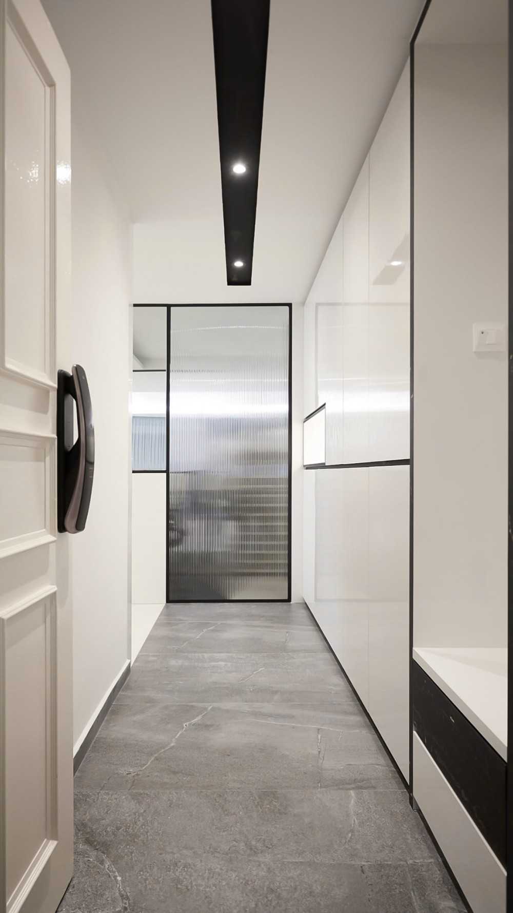 Modern Foyer with Paintings and Display Cabinets