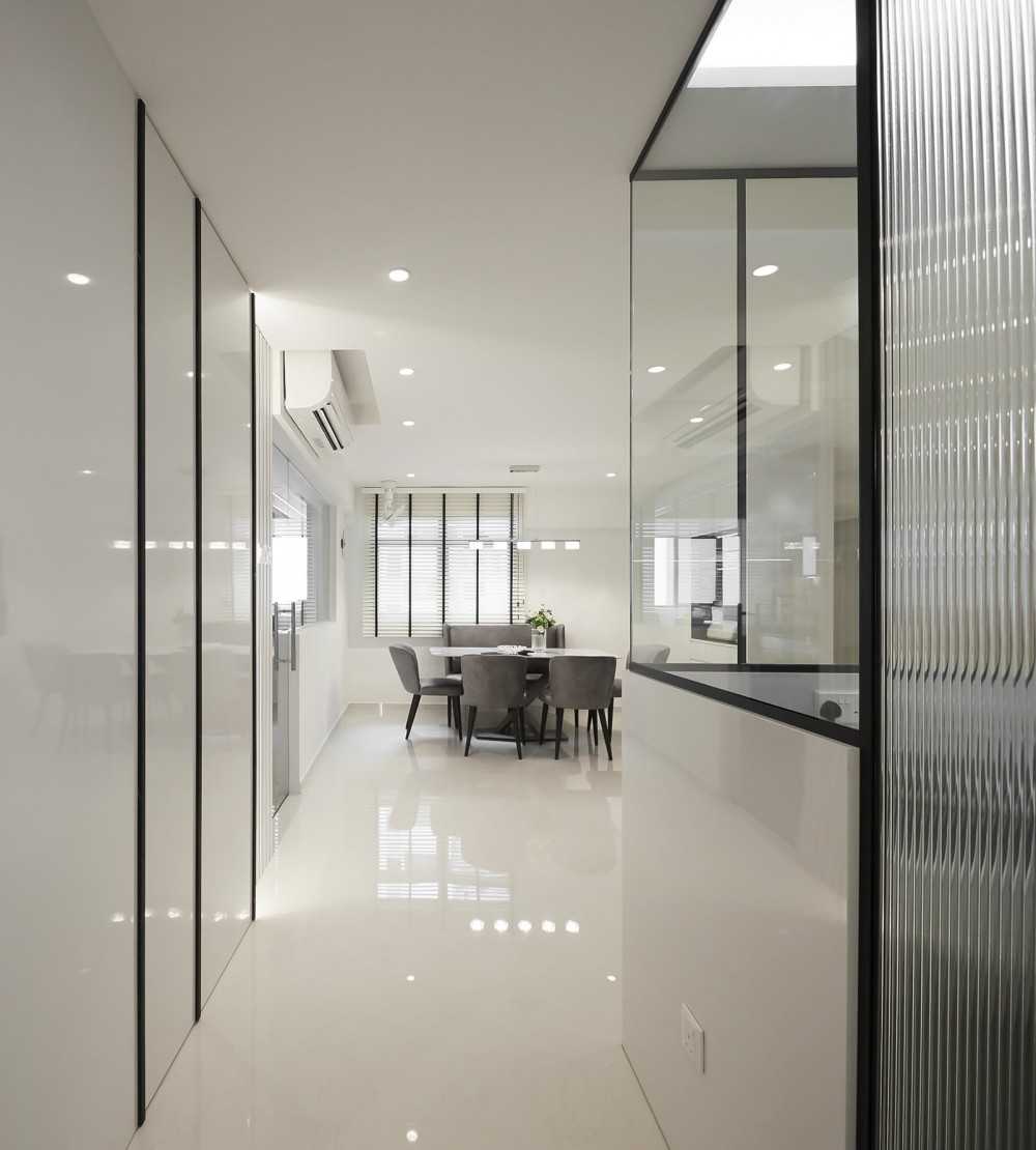 Modern Foyer with Glass Door and Paintings