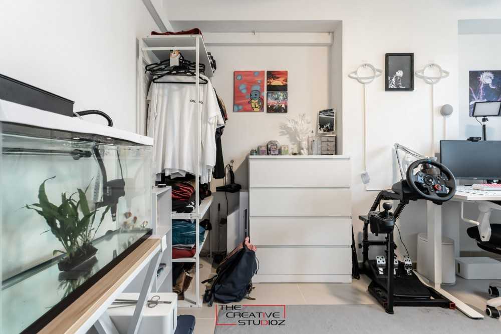 Modern Bedroom with Bookshelf and Homogeneous Tiles