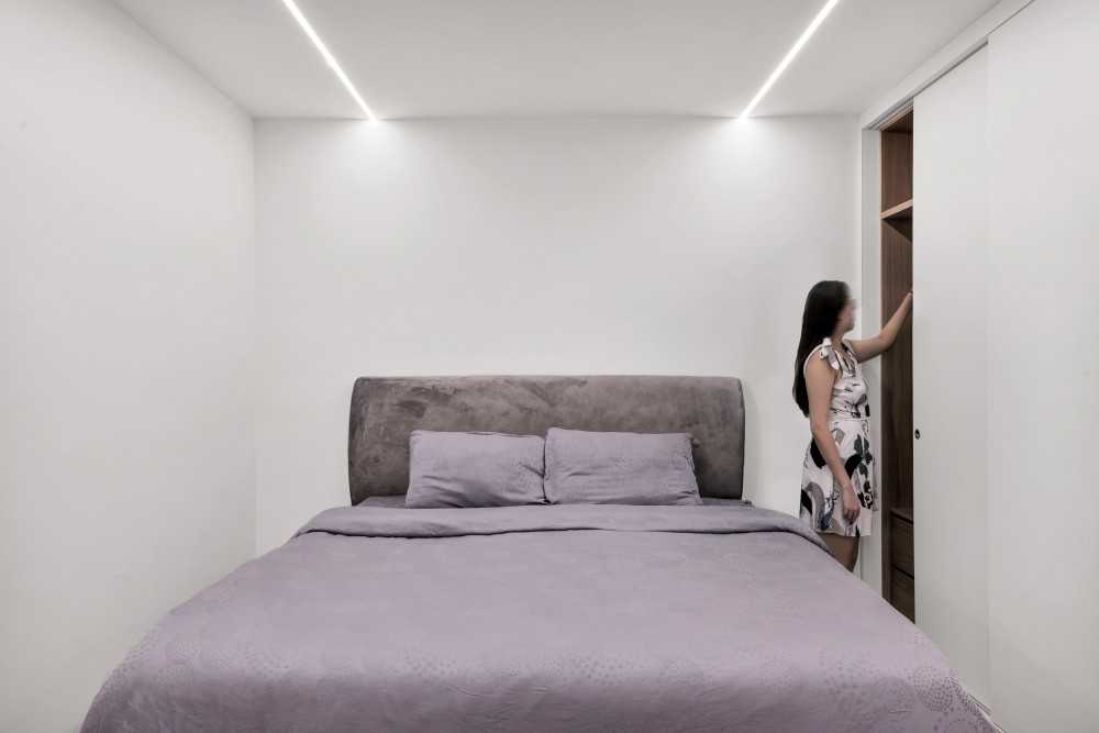 Minimalist Bedroom with Drop Light and Ceiling Light