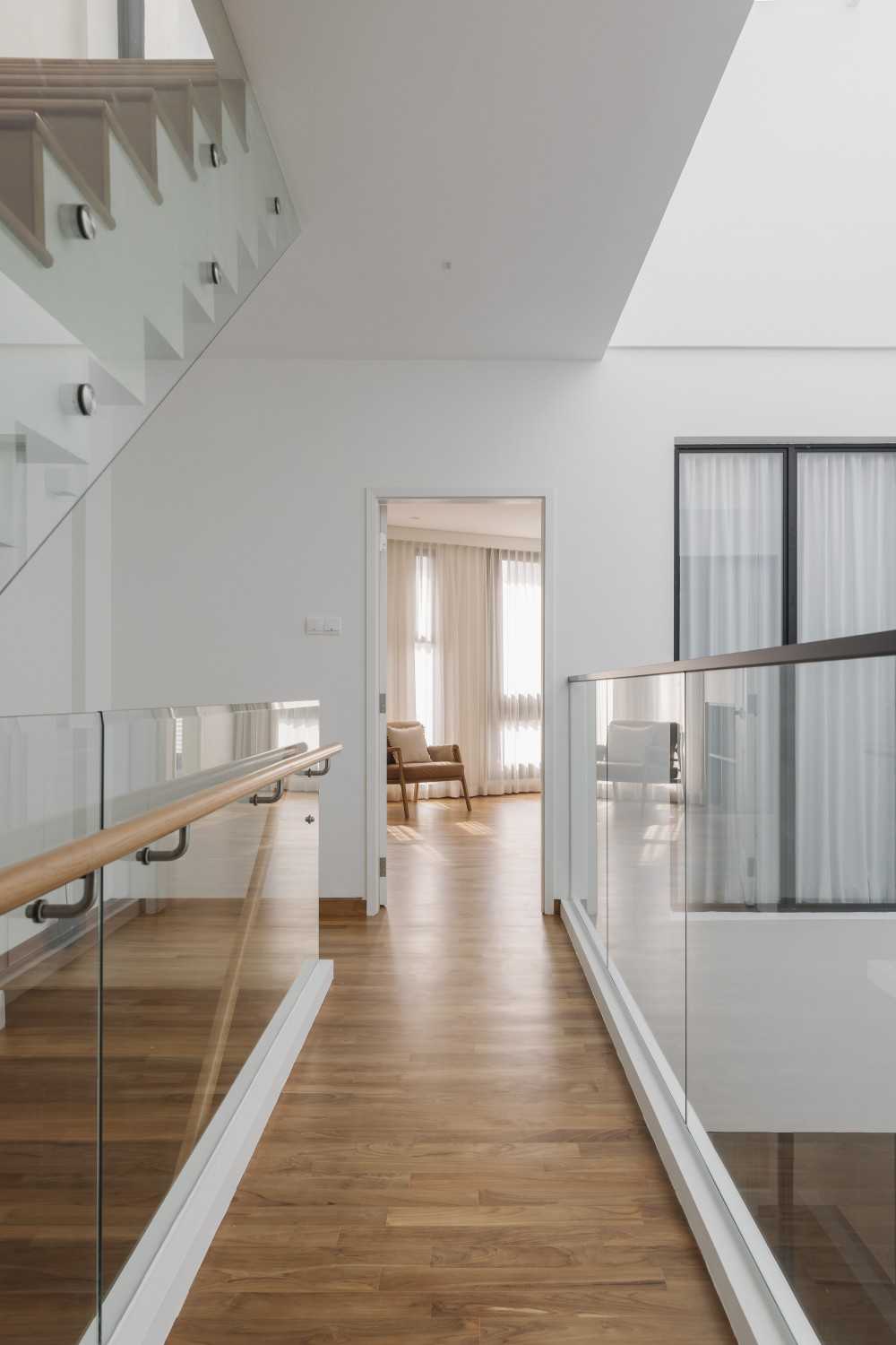 Minimalist Hallway with Parquet Floor and Staircase