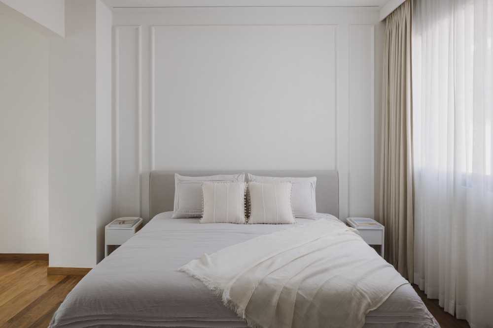Minimalist Bedroom with Parquet Floor and Feature Wall