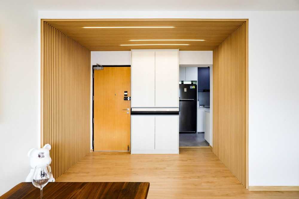 Scandinavian Entryway with Feature Wall and Storage Cabinets