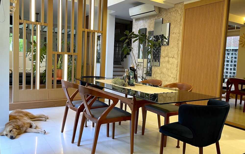 Transitional Dining Room with Feature Wall and Dining Table