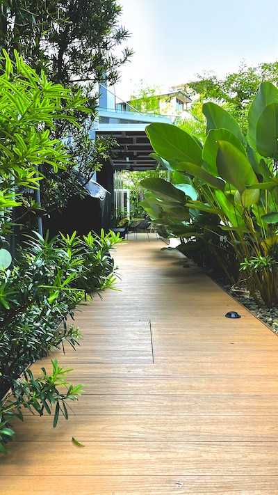 Transitional Garden with Wood Flooring and Trellis