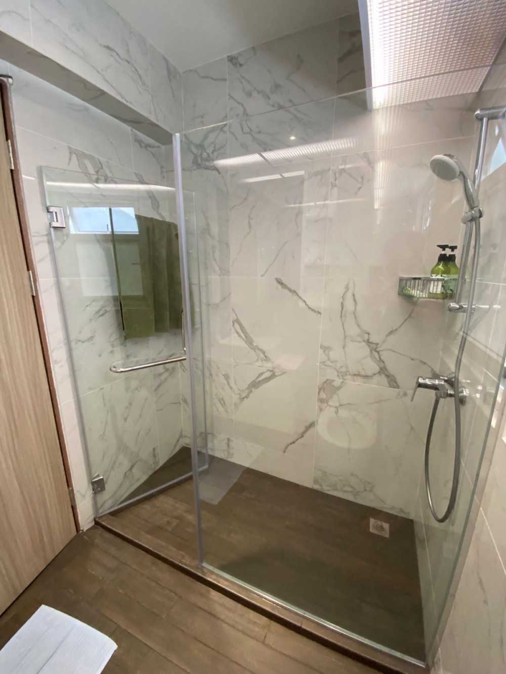 Scandinavian Bathroom with Shower Screen and Paintings
