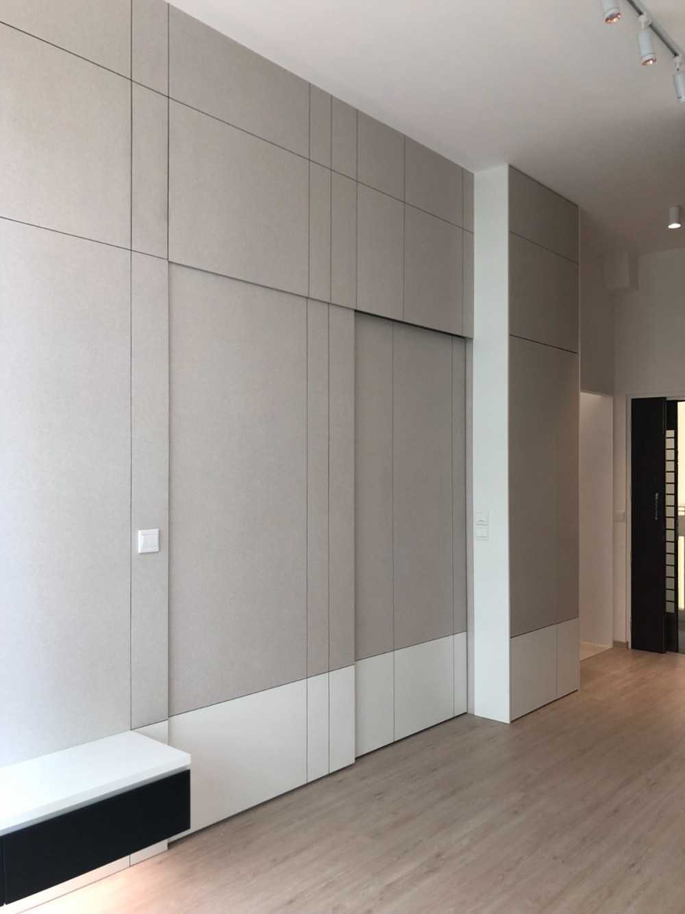 Scandinavian Foyer with Feature Wall and Storage Cabinets