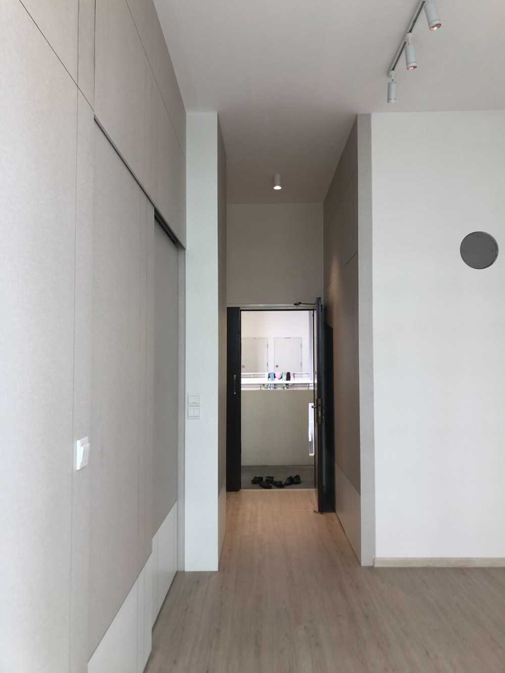 Scandinavian Foyer with Feature Wall and Paintings