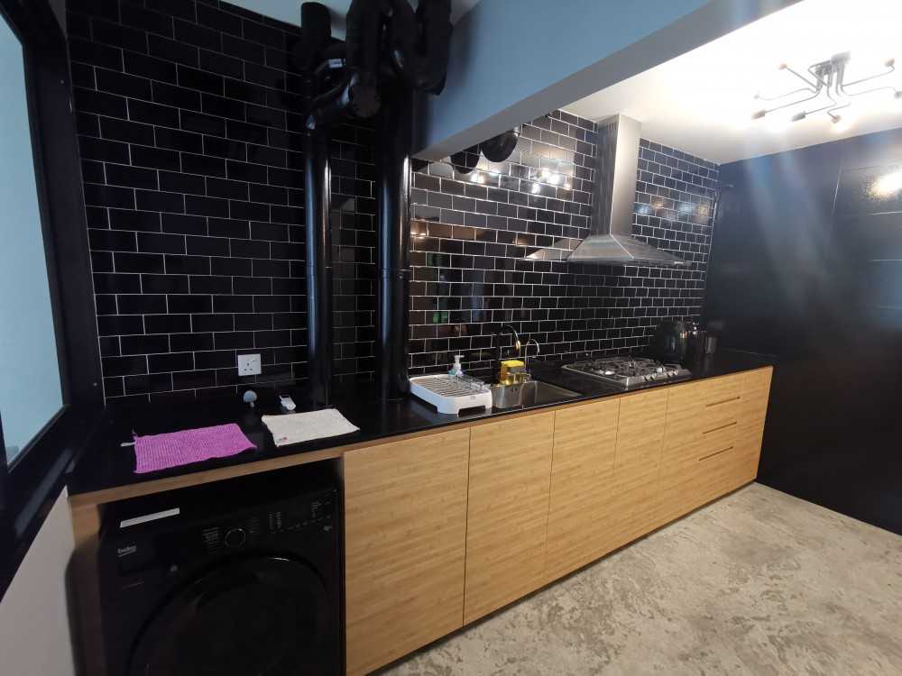 Industrial Kitchen with Cement Floor and Mosaic