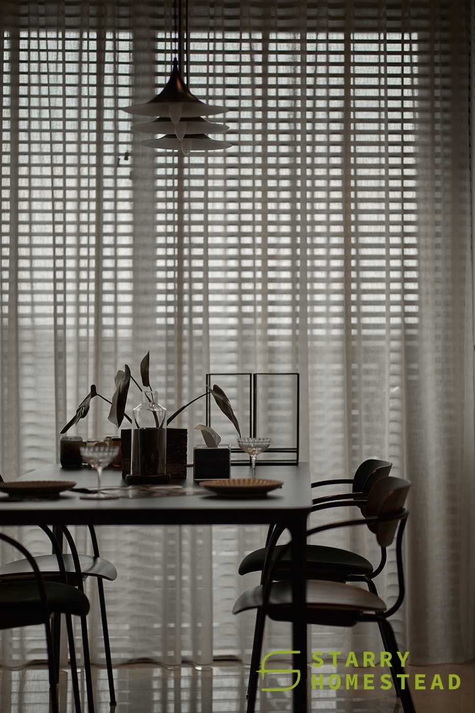 Modern Dining Room with Drop Light and Window Shutters