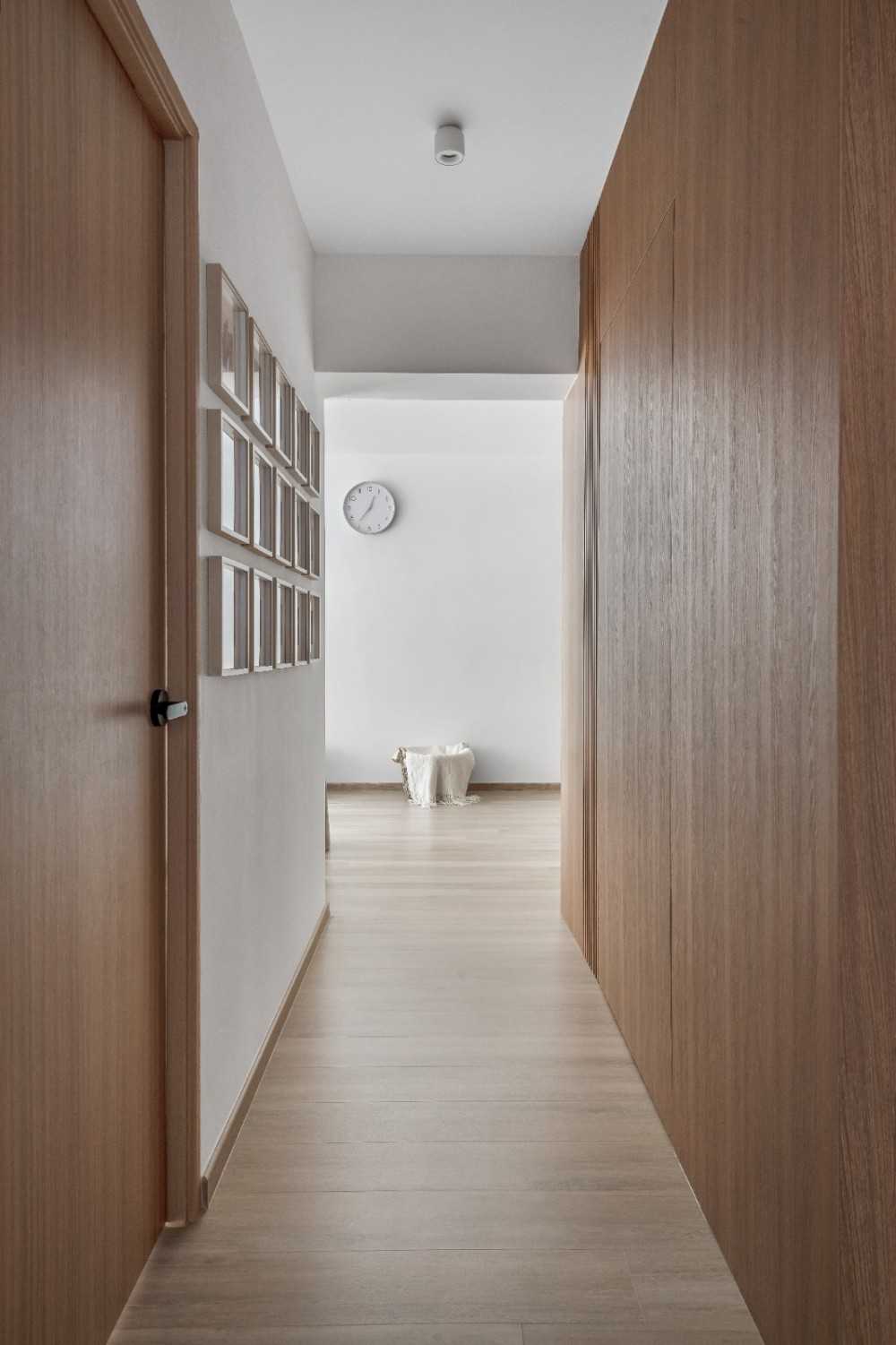 Scandinavian Hallway with Bookshelf and Artwork