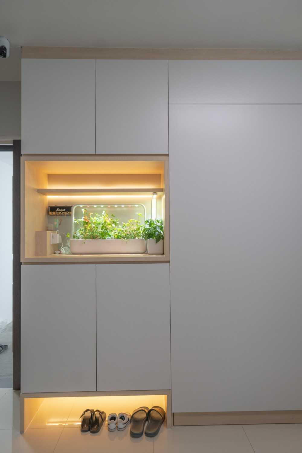 Scandinavian Entryway with Shoe Rack and Storage Cabinets