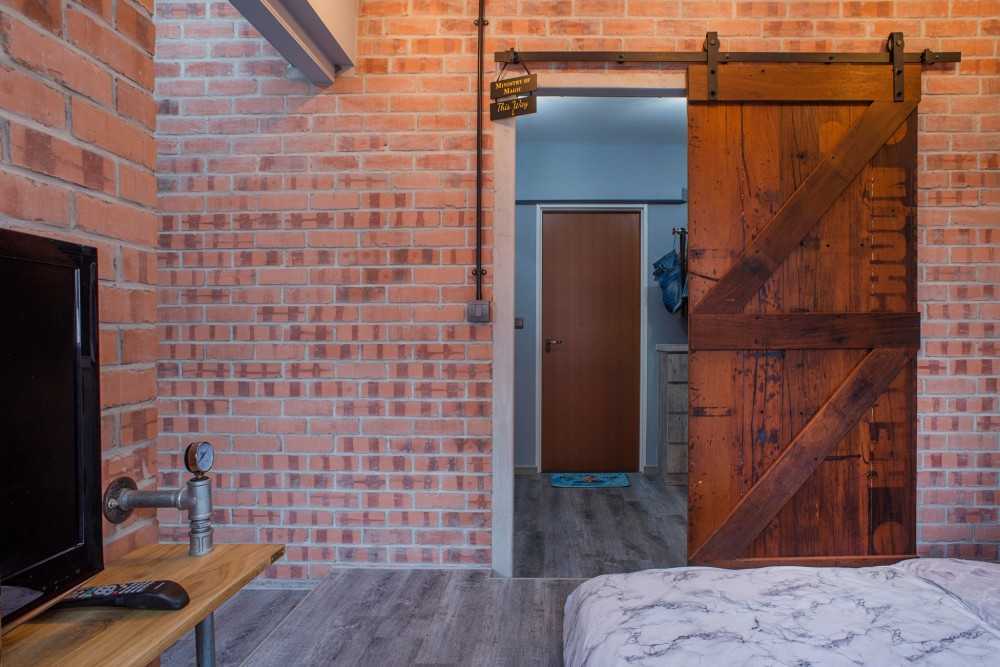 Industrial Bedroom with Vinyl Flooring and TV Console