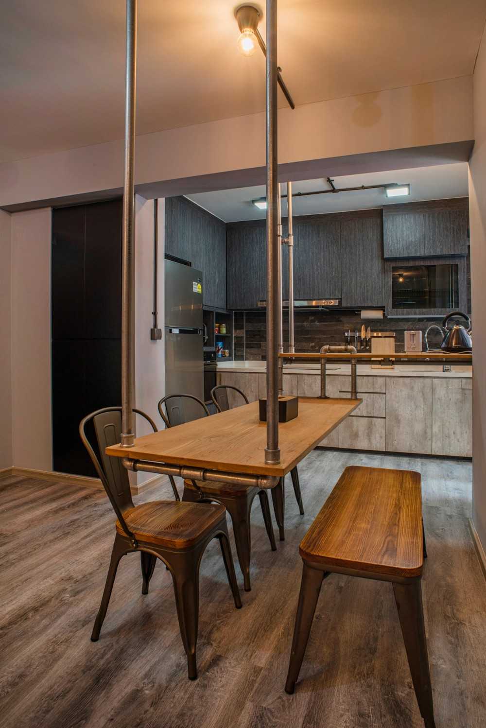 Industrial Dining Room with Drop Light and Dining Table