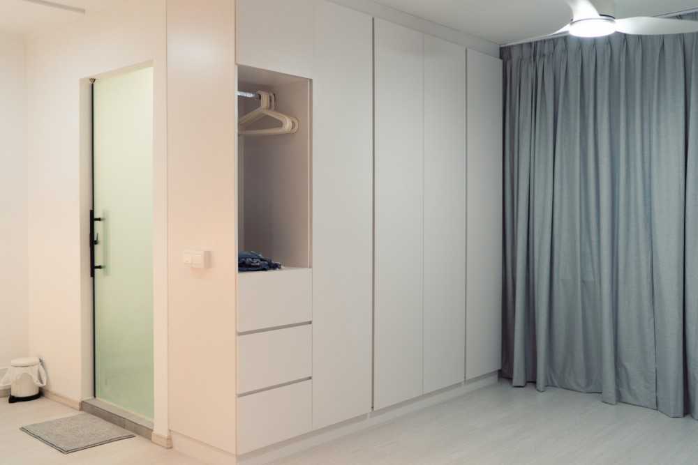 Minimalist Bedroom with Vinyl Flooring and Glass Door