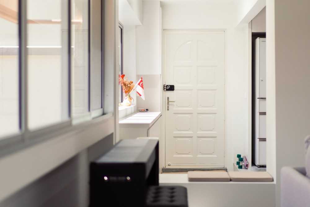 Minimalist Entryway with Cupboard and Seating Bench