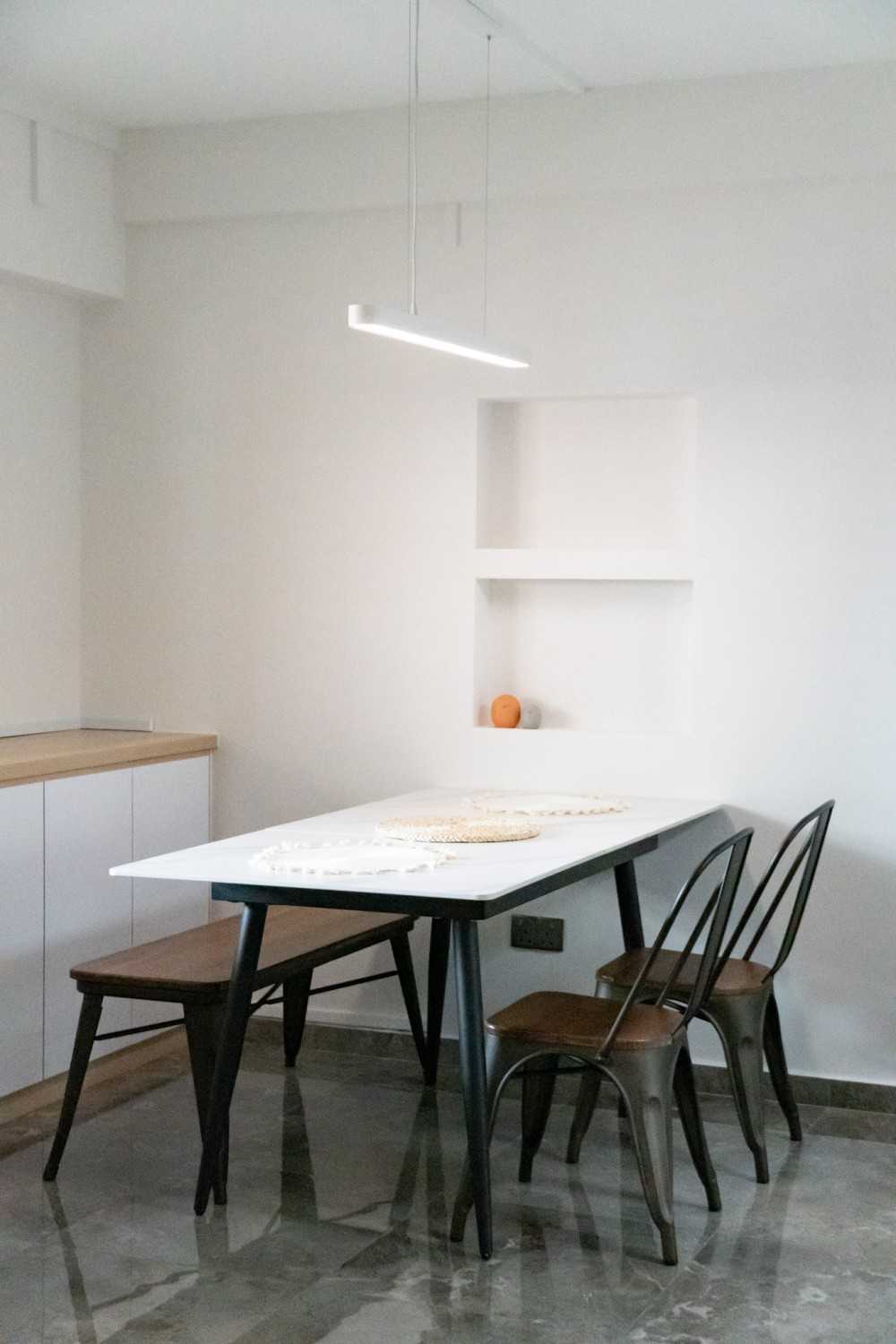 Scandinavian Dining Room with Ceiling Light and Dining Table