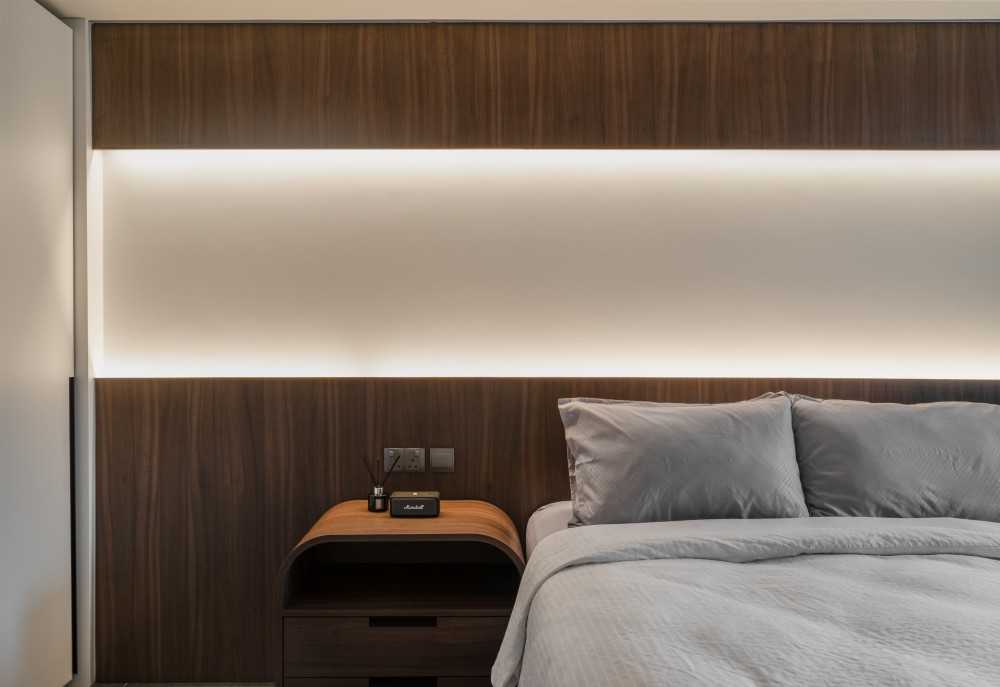 Contemporary Bedroom with Cove Lighting and Bedside Table