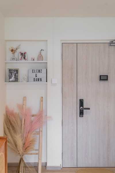 Scandinavian Entryway with Small Storage and Wall Shelves