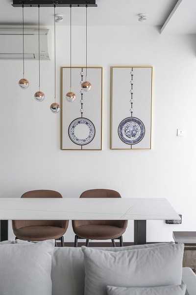 Asian Dining Room with Drop Light and Dining Table