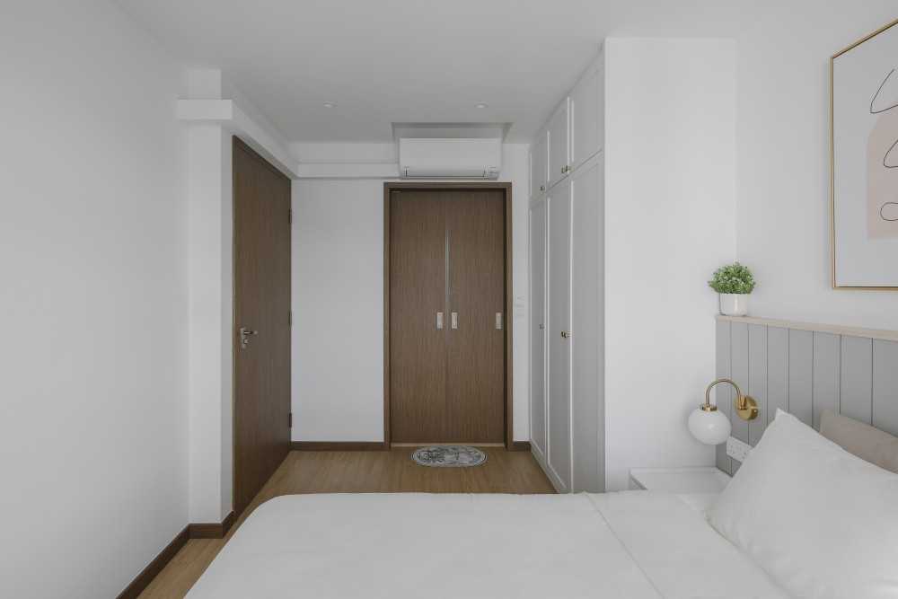 Scandinavian Bedroom with Wood Flooring and Artwork