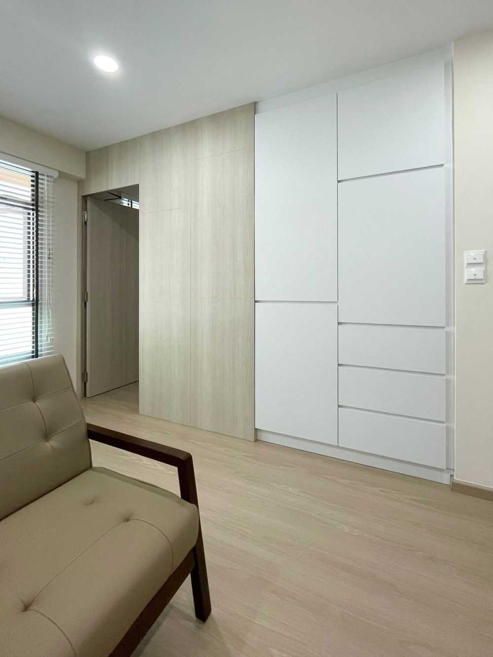 Scandinavian Living Room with Window Grille and Storage Cabinets