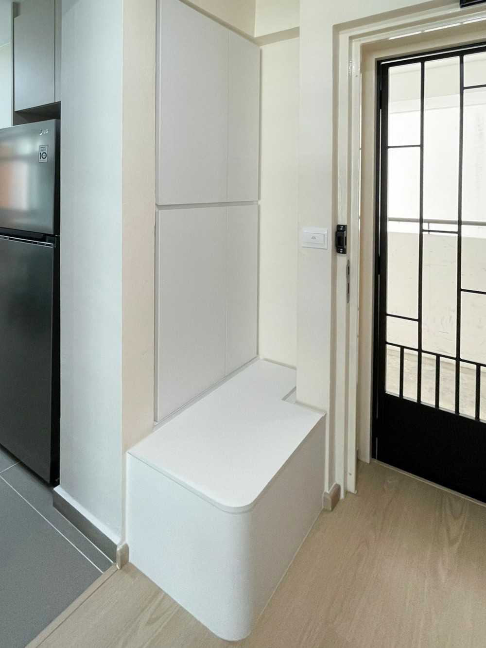 Scandinavian Foyer with Paintings and Storage Cabinets