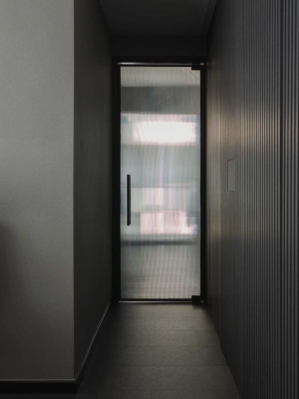 Modern Hallway with Feature Wall and Doors