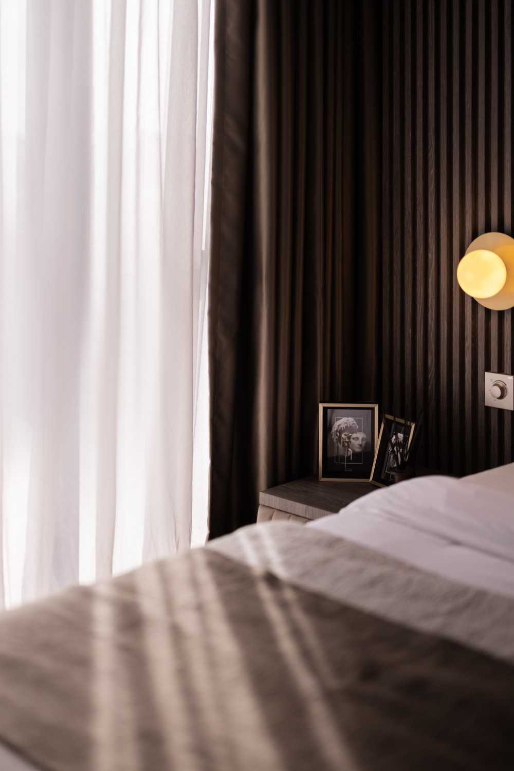 Modern Bedroom with Cove Lighting and Built-in Bed