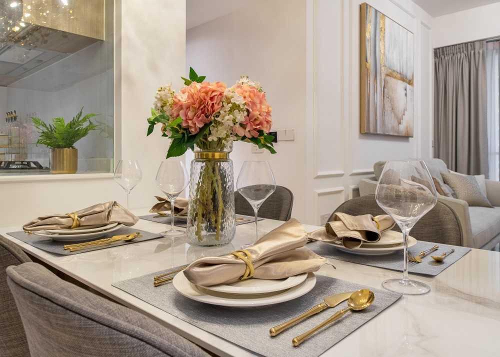 Modern Dining Room with Cove Lighting and Chandelier