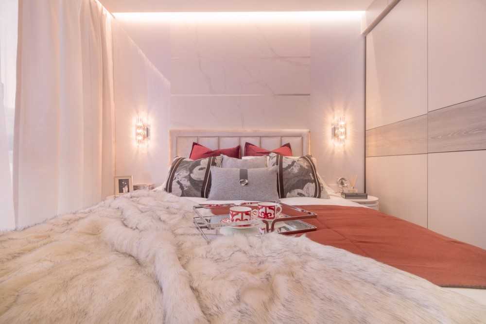 Modern Bedroom with Marble Floor and Cove Lighting