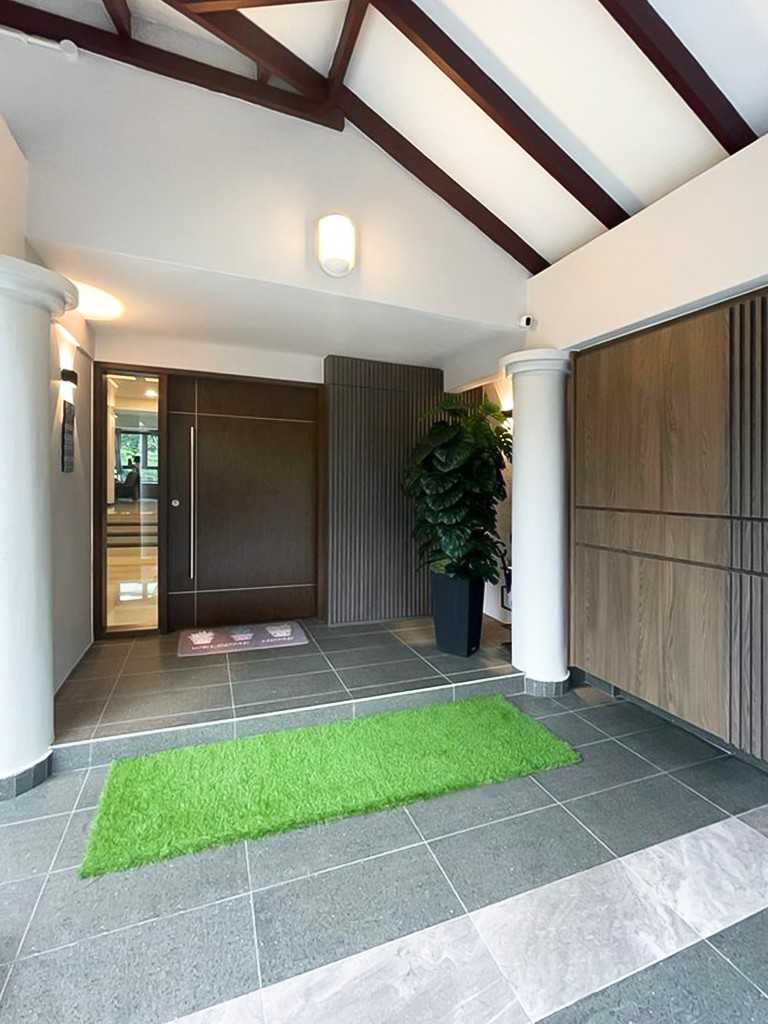 Modern Foyer with Paintings and Storage Cabinets