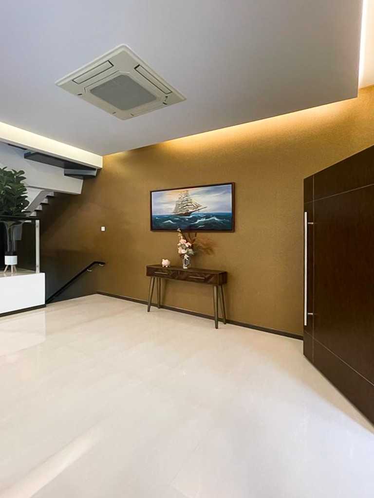 Modern Foyer with Paintings and Storage Cabinets