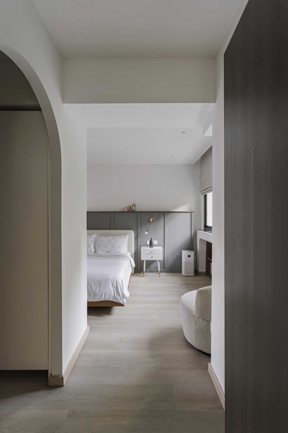Modern Bedroom with Wood Flooring and Ceiling Light