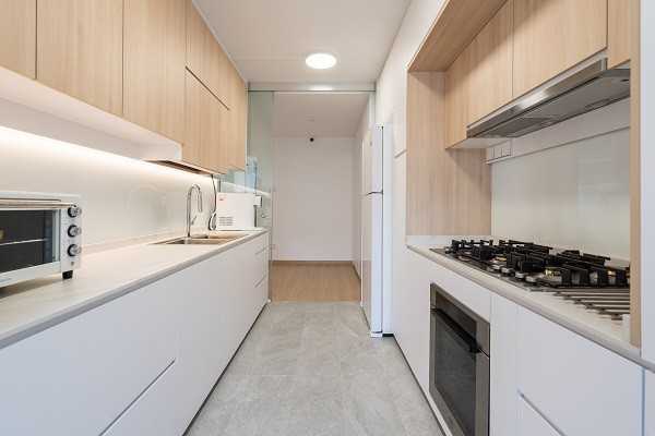 Scandinavian Kitchen with Homogeneous Tiles and Cupboard