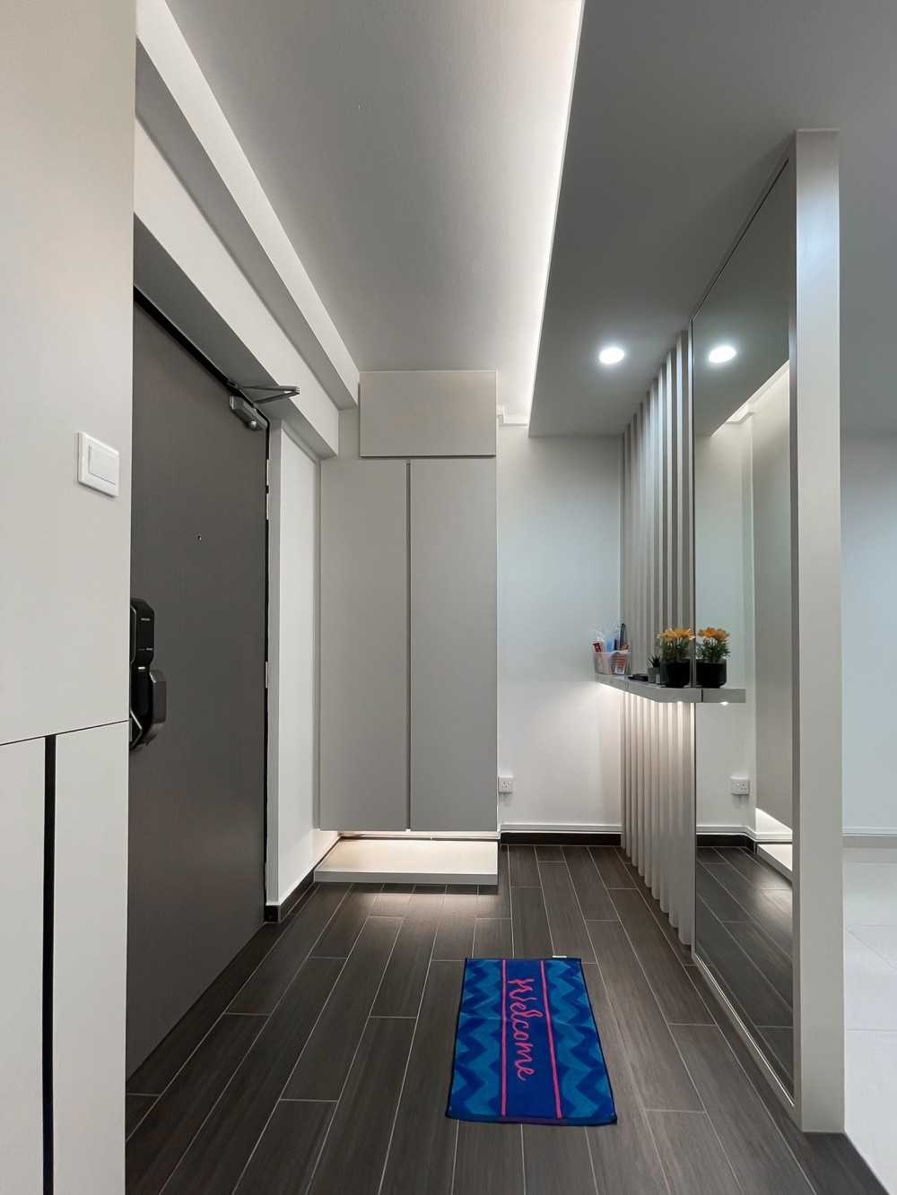 Scandinavian Foyer with Mirror and Paintings