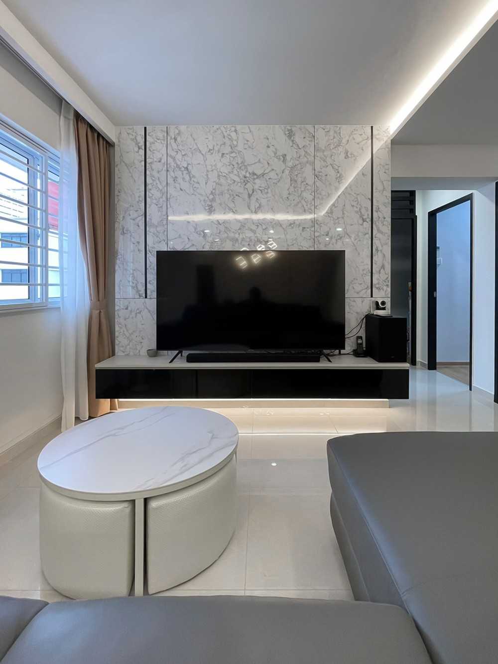 Scandinavian Living Room with TV Console and Window Grille