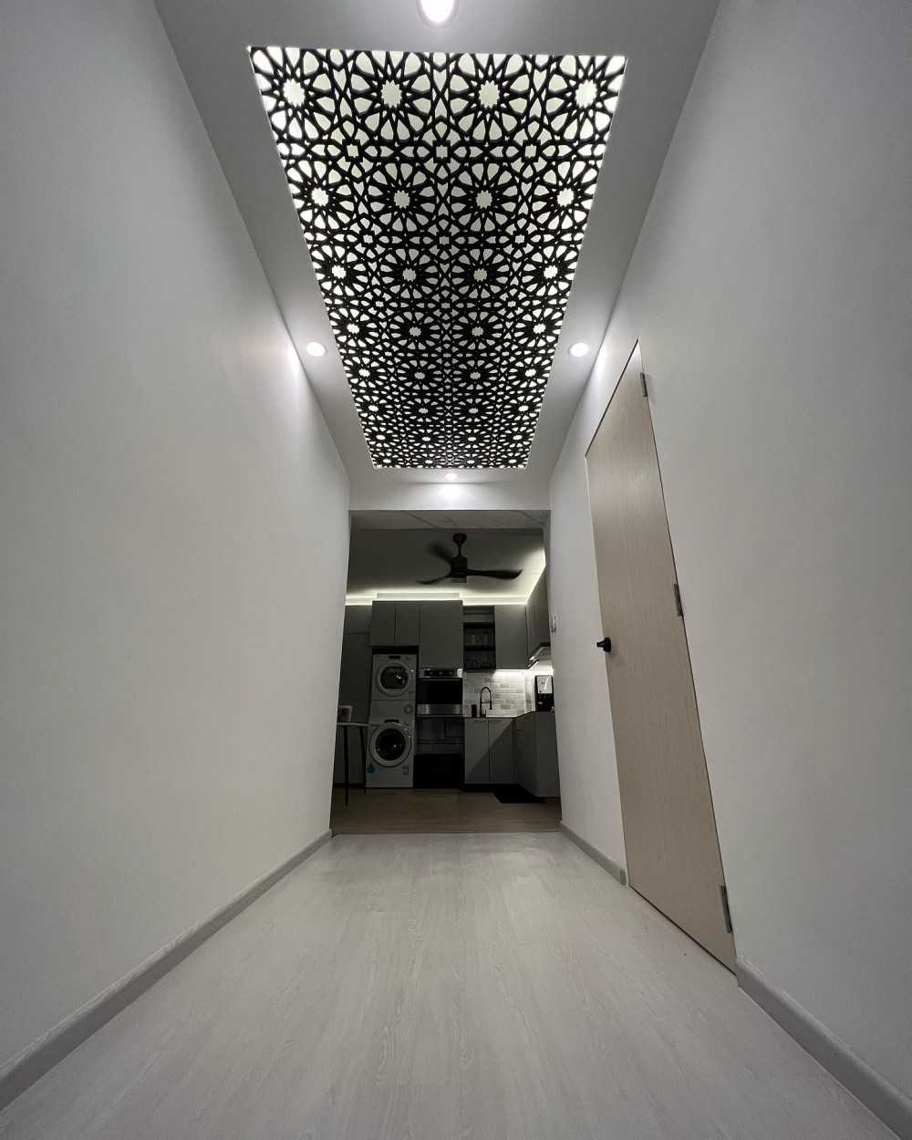 Minimalist Hallway with Cove Lighting and Drop Ceiling