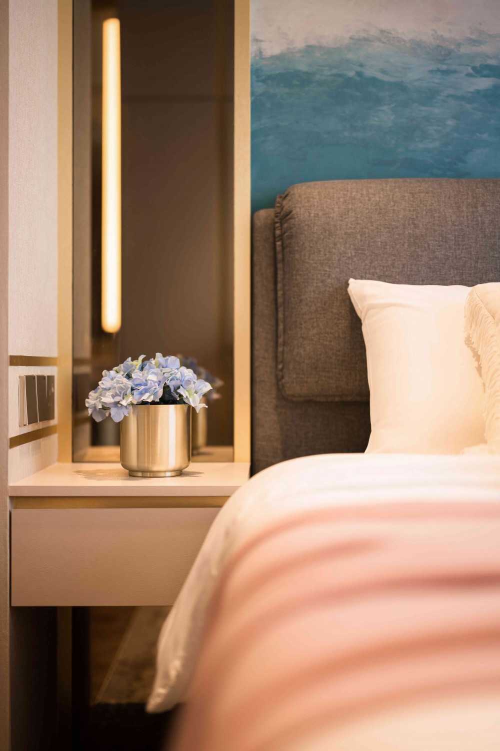 Modern Bedroom with Cove Lighting and Bedside Table