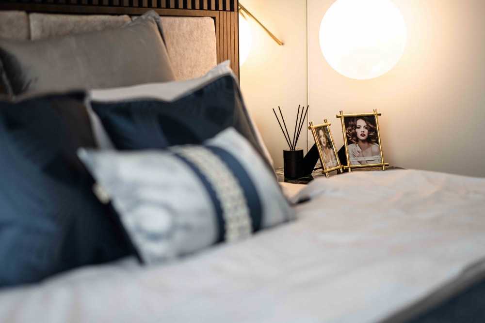 Modern Bedroom with Cove Lighting and Built-in Bed