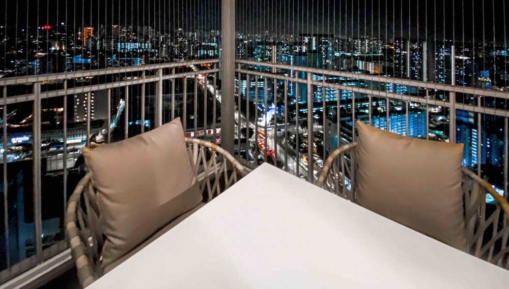 Modern Balcony with Window Grille and Outdoor Table