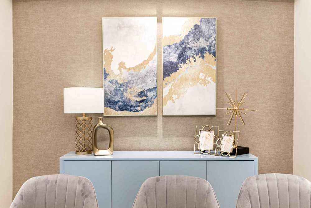 Transitional Hallway with Bookshelf and Artwork